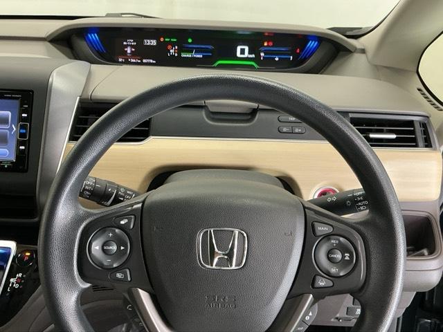 フリードハイブリッド ハイブリッド・Ｇホンダセンシング　ナビ　Ｒカメラ　ブルートゥース　フルセグ　軽減ブレーキ　キーフリーシステム　記録簿　ＤＶＤ再生可能　ＥＣＯＮ　後カメラ　Ａクルーズ　ＬＥＤヘッドランプ　横滑防止　パワーウインドウ　３列シート　ＥＴＣ付（22枚目）