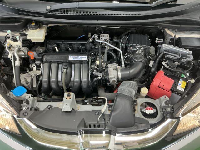 フィットハイブリッド Ｌパッケージ　ナビ　Ｒカメラ　ブルートゥース　フルセグ　サイドエアバック　ＤＶＤ再生　ＬＥＤ　ＥＣＯＮ　バックカメラ　オートクルーズコントロール　イモビライザー　ＥＴＣ　ＥＳＣ　ＡＵＴＯエアコン　ＡＢＳ　キーフリー（27枚目）