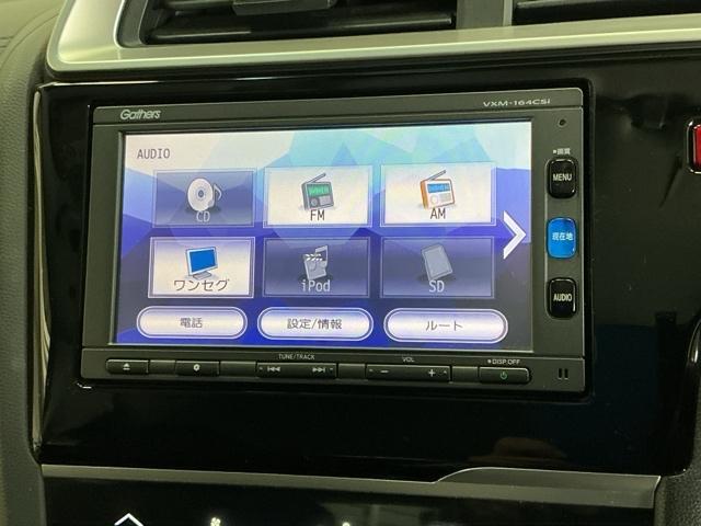 フィットハイブリッド Fパッケージ ナビ Rカメラ ブルートゥース TV CD 盗難警報装置 記録簿有り AUTOエアコン 助手席エアバック ECON ETC付き リヤカメラ ABS付 横滑り防止システム キーレスエントリー ワンセグ(11枚目)