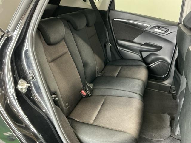 フィットハイブリッド Fパッケージ ナビ Rカメラ ブルートゥース TV CD 盗難警報装置 記録簿有り AUTOエアコン 助手席エアバック ECON ETC付き リヤカメラ ABS付 横滑り防止システム キーレスエントリー ワンセグ(18枚目)