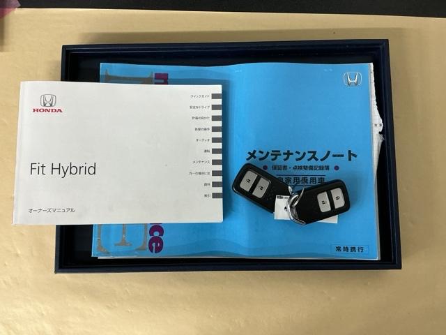 フィットハイブリッド Fパッケージ ナビ Rカメラ ブルートゥース TV CD 盗難警報装置 記録簿有り AUTOエアコン 助手席エアバック ECON ETC付き リヤカメラ ABS付 横滑り防止システム キーレスエントリー ワンセグ(25枚目)