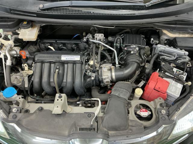 フィットハイブリッド Fパッケージ ナビ Rカメラ ブルートゥース TV CD 盗難警報装置 記録簿有り AUTOエアコン 助手席エアバック ECON ETC付き リヤカメラ ABS付 横滑り防止システム キーレスエントリー ワンセグ(26枚目)