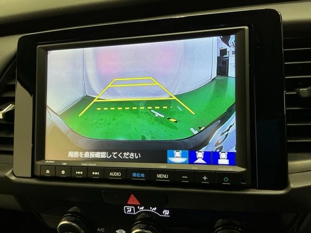 フィット ｅ：ＨＥＶホーム　ドラレコ　ナビ　Ｒカメラ　ブルートゥース　前後誤発進抑制機能　助手席エアバッグ　運転席エアバッグ　アイドリングストップ　ＬＥＤライト　ＵＳＢ接続　バックカメラ　ＡＢＳ　サイドエアバッグ　フルセグＴＶ（12枚目）