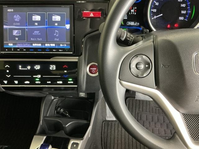 フィットハイブリッド Ｆパッケージコンフォートエディション　ナビ　Ｒカメラ　ブルートゥース　フルセグ　セキュリティアラーム　リアカメラ　ＥＴＣ車載器　エアコン　スマートキー　アイドリングストップ　キーレス　ＬＥＤ　ＶＳＡ　前席シートヒーター　ＡＢＳ　ＤＶＤ再生（3枚目）
