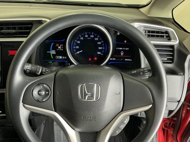 フィットハイブリッド Ｆパッケージコンフォートエディション　ナビ　Ｒカメラ　ブルートゥース　フルセグ　セキュリティアラーム　リアカメラ　ＥＴＣ車載器　エアコン　スマートキー　アイドリングストップ　キーレス　ＬＥＤ　ＶＳＡ　前席シートヒーター　ＡＢＳ　ＤＶＤ再生（20枚目）