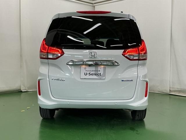 フリードハイブリッド ハイブリッド・Ｇホンダセンシング　ナビ　Ｒカメラ　ブルートゥース　フルセグ　軽減ブレーキ　キーフリーシステム　記録簿　ＤＶＤ再生可能　ＥＣＯＮ　後カメラ　Ａクルーズ　ＬＥＤヘッドランプ　シートＨ　横滑防止　パワーウインドウ　３列シート（9枚目）