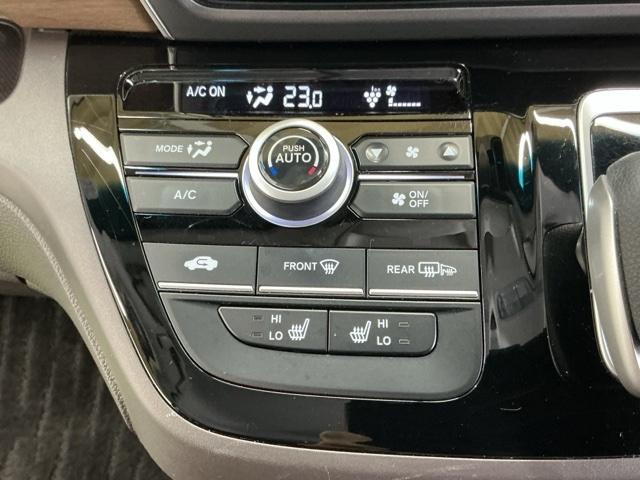 フリードハイブリッド ハイブリッド・Ｇホンダセンシング　ナビ　Ｒカメラ　ブルートゥース　フルセグ　軽減ブレーキ　キーフリーシステム　記録簿　ＤＶＤ再生可能　ＥＣＯＮ　後カメラ　Ａクルーズ　ＬＥＤヘッドランプ　シートＨ　横滑防止　パワーウインドウ　３列シート（15枚目）