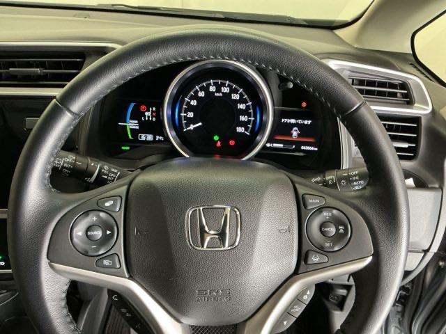 フィットハイブリッド Ｌホンダセンシング　ドラレコ　ナビ　Ｒカメラ　ブルートゥース　軽減ブレーキ　ＬＥＤ　サイドＳＲＳ　横滑り防止　ドライブレコーダー　フルセグテレビ　記録簿　パワーステアリング　盗難防止装置　オートクルーズ　ＥＴＣ車載器（21枚目）