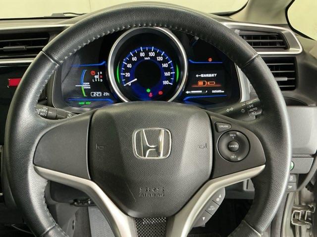 フィットハイブリッド Ｌパッケージ　ナビ　ＤＶＤ　ＣＤ　ワンセグＴＶ　ＥＴＣ　ＬＥＤ　ＥＣＯＮ　オートクルーズコントロール　イモビライザー　１セグＴＶ　ＥＳＣ　ＡＵＴＯエアコン　ＡＢＳ　運転席助手席エアバッグ　運転席エアバック（17枚目）