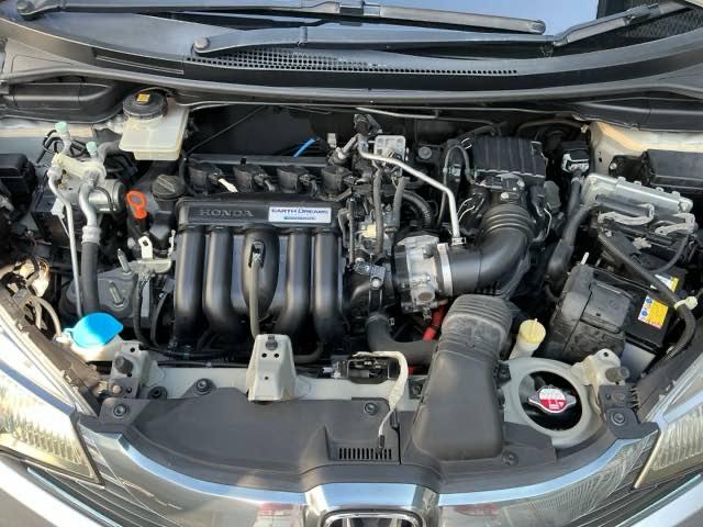 フィットハイブリッド Ｌパッケージ　ナビ　ＤＶＤ　ＣＤ　ワンセグＴＶ　ＥＴＣ　ＬＥＤ　ＥＣＯＮ　オートクルーズコントロール　イモビライザー　１セグＴＶ　ＥＳＣ　ＡＵＴＯエアコン　ＡＢＳ　運転席助手席エアバッグ　運転席エアバック（23枚目）