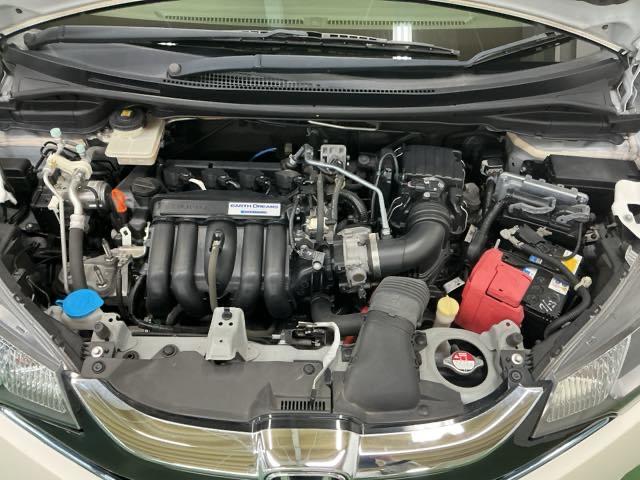 フィットハイブリッド Fパッケージコンフォートエディション ナビ Rカメラ ブルートゥース フルセグTV 地デジフルセグ セキュリティアラーム リアカメラ ETC車載器 エアコン スマートキー アイドリングストップ キーレス 前席シートヒーター ABS(27枚目)