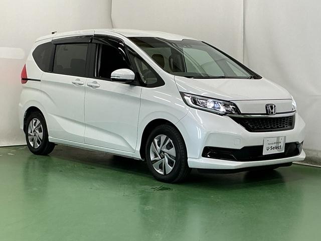 フリードハイブリッド ハイブリッド・Ｇ　ドラレコ　ナビ　Ｒカメラ　ブルートゥース　両側パワスラドア　ＥＴＣ車載器　クルーズコントロール　記録簿　スマートキープッシュスタート　ＡＡＣ　キーレス　ｉ－ＳＴＯＰ　シートヒータ　両席エアバック（7枚目）