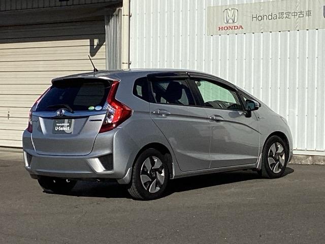 フィットハイブリッド Fパッケージ ETC/純正ナビ/バックモニター 盗難警報装置 記録簿有り AUTOエアコン 助手席エアバック ECON ETC付き リヤカメラ ABS付 DVD視聴 横滑り防止システム キーレスエントリー ワンセグ(8枚目)