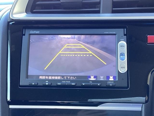 フィットハイブリッド Fパッケージ ETC/純正ナビ/バックモニター 盗難警報装置 記録簿有り AUTOエアコン 助手席エアバック ECON ETC付き リヤカメラ ABS付 DVD視聴 横滑り防止システム キーレスエントリー ワンセグ(12枚目)