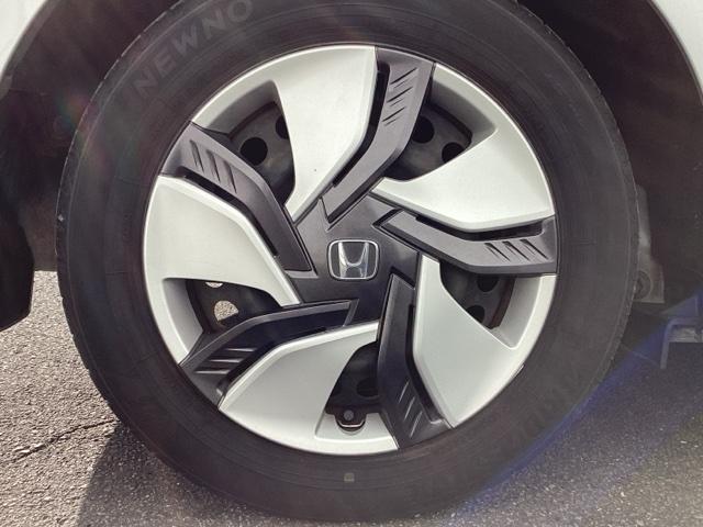 フィットハイブリッド Fパッケージ ETC/純正ナビ/バックモニター 盗難警報装置 記録簿有り AUTOエアコン 助手席エアバック ECON ETC付き リヤカメラ ABS付 DVD視聴 横滑り防止システム キーレスエントリー ワンセグ(20枚目)