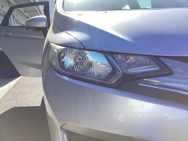 フィットハイブリッド Fパッケージ ETC/純正ナビ/バックモニター 盗難警報装置 記録簿有り AUTOエアコン 助手席エアバック ECON ETC付き リヤカメラ ABS付 DVD視聴 横滑り防止システム キーレスエントリー ワンセグ(21枚目)