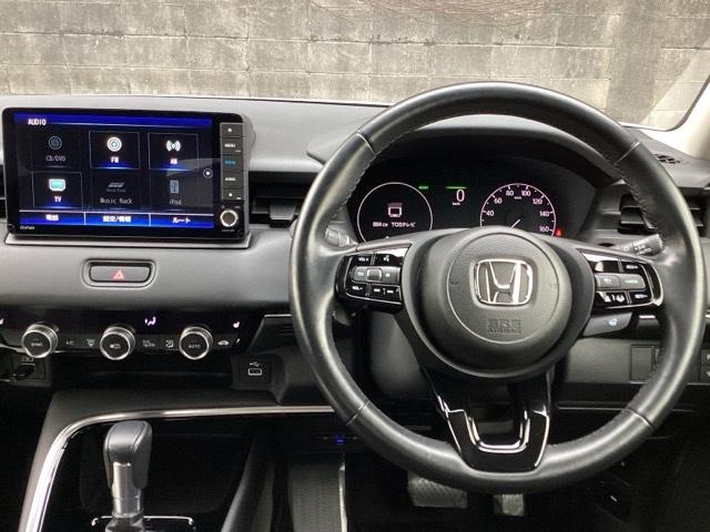 ヴェゼル ｅ：ＨＥＶＺ　ブラインドスポットインフォメーション／ハンズフリーアクセスパワーテールゲート（予約クローズ機能付　Ｓヒータ　地デジフルセグＴＶ　定期点検記録簿　サイドエアバッグ　後カメラ　前後障害物センサー　エアコン（3枚目）