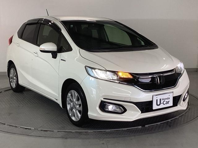 フィットハイブリッド Ｌホンダセンシング　純正ナビ　スマートキー　ドラレコ　ヘッドライトＬＥＤ　セキュリティアラーム　運転席エアバッグ　横滑り防止機能　サイドエアバッグ　Ｒカメ　キーレス　オートクルーズ　ＥＴＣ車載器　Ａストップ　ＡＢＳ（7枚目）