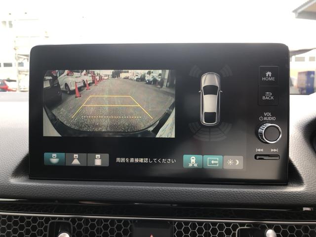 シビック ＬＸ　登録済未使用車　クルコン　リアカメラ　横滑り防止装置　禁煙車　１オーナー　ソナー　ターボ車　シートヒーター　オートエアコン　サイドエアバッグ　パワーウィンドウ　ＡＢＳ　スマートキー　エアバッグ　地デジ（7枚目）