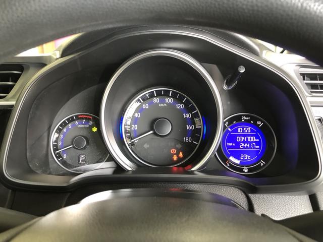 フィット １３Ｇ・Ｆ　ＣＤプレイヤー　ワンオーナー　禁煙車　スマートキー　記録簿　キーフリーシステム　両席エアバック　横滑り防止装置付　ＡＢＳ　スマートキ－　運転席エアバッグ　ＡＵＴＯエアコン　パワーウィンドー　パワステ（9枚目）