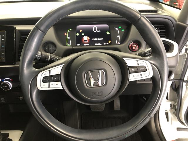 フィット ｅ：ＨＥＶホーム　純正ナビ　ＥＴＣ　前後ドラレコ　ＬＥＤ　ワンオーナー　禁煙車　前後ブレーキサポート　盗難防止　クリアランスソナー　ＥＣＯモード　１オーナー　バックガイドモニター　スマートキー　オートクルーズ　記録簿付（13枚目）