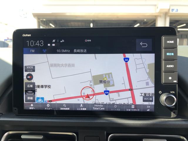 フリード e:HEVクロスター 試乗車アップ 純正ナビ ETC 前後ドラレコ 両側電動ドア LED アルミホイール Sヒーター 衝突軽減ブレーキシステム フルセグ 禁煙車 オートエアコン バックモニター パーキングセンサー キーレス(5枚目)