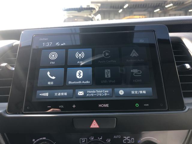 フィット ｅ：ＨＥＶホーム　試乗車アップ　純正ディスプレイオーディオ　ＬＥＤ　禁煙車　前後誤発進抑制機能　クリソナ　助手席エアバッグ　運転席エアバッグ　アイドリングストップ　ＵＳＢ接続　バックカメラ　ＡＢＳ　サイドエアバッグ（5枚目）