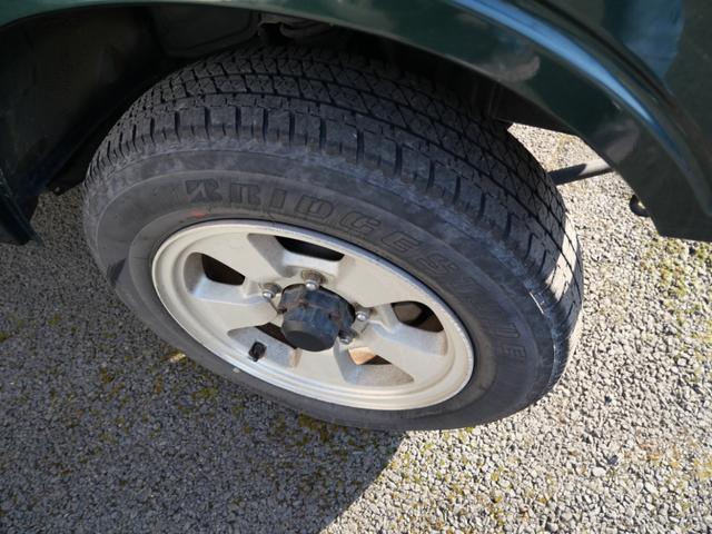 ジムニー ワイルドウインド　メモリーナビ　ＴＶ　ＣＤ　社外キーレスエントリー　社外デジタルインナーミラー　レザー調シートカバー　ＥＴＣ　ＦＲバンパー（9枚目）