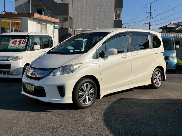 フリードハイブリッド ジャストセレクション　ワンオーナー　禁煙車　ナビ　ワンセグＴＶ　バックカメラ　社外ＬＥＤヘッドライト　純正アルミ　両側パワースライドドア　プライバシーガラス　クルーズコントロール　スマートキー（2枚目）