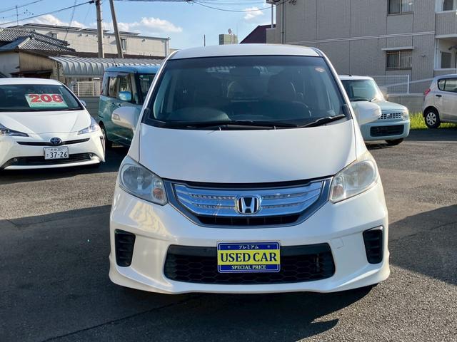 フリードハイブリッド ジャストセレクション　ワンオーナー　禁煙車　ナビ　ワンセグＴＶ　バックカメラ　社外ＬＥＤヘッドライト　純正アルミ　両側パワースライドドア　プライバシーガラス　クルーズコントロール　スマートキー（3枚目）