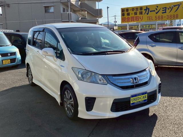 フリードハイブリッド ジャストセレクション　ワンオーナー　禁煙車　ナビ　ワンセグＴＶ　バックカメラ　社外ＬＥＤヘッドライト　純正アルミ　両側パワースライドドア　プライバシーガラス　クルーズコントロール　スマートキー（4枚目）