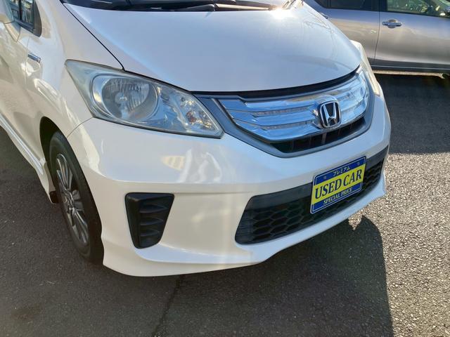 フリードハイブリッド ジャストセレクション　ワンオーナー　禁煙車　ナビ　ワンセグＴＶ　バックカメラ　社外ＬＥＤヘッドライト　純正アルミ　両側パワースライドドア　プライバシーガラス　クルーズコントロール　スマートキー（5枚目）