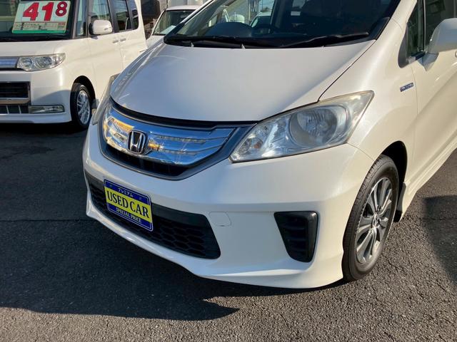 フリードハイブリッド ジャストセレクション　ワンオーナー　禁煙車　ナビ　ワンセグＴＶ　バックカメラ　社外ＬＥＤヘッドライト　純正アルミ　両側パワースライドドア　プライバシーガラス　クルーズコントロール　スマートキー（6枚目）