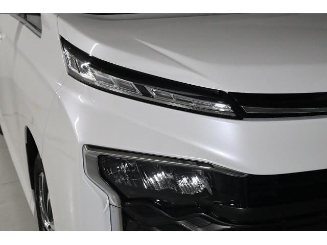 ヴォクシー ハイブリッドＳ－Ｚ　フルセグ　メモリーナビ　ＤＶＤ再生　ミュージックプレイヤー接続可　後席モニター　バックカメラ　衝突被害軽減システム　ＥＴＣ　両側電動スライド　ＬＥＤヘッドランプ　乗車定員７人　３列シート　ワンオーナー（22枚目）