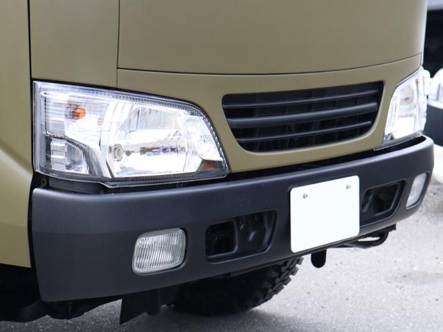 ダイナトラック Wキャブロングジャストロー ダブルキャブ リフトアップ 輸出ホイール ジオランダーMT 2500cc ディーゼルターボ マットカーキ オーバーフェンダー パイプフェンダー 後期ルックヘッドライト シートカバー マフラー(14枚目)