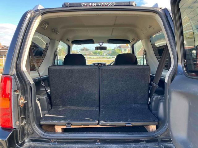 ジムニー ワイルドウインド 4WD ナビ キーレスエントリー 電動格納ミラー シートヒーター MT 盗難防止システム ABS CD DVD再生 ミュージックプレイヤー接続可 Bluetooth ルーフレール アルミホイール(19枚目)