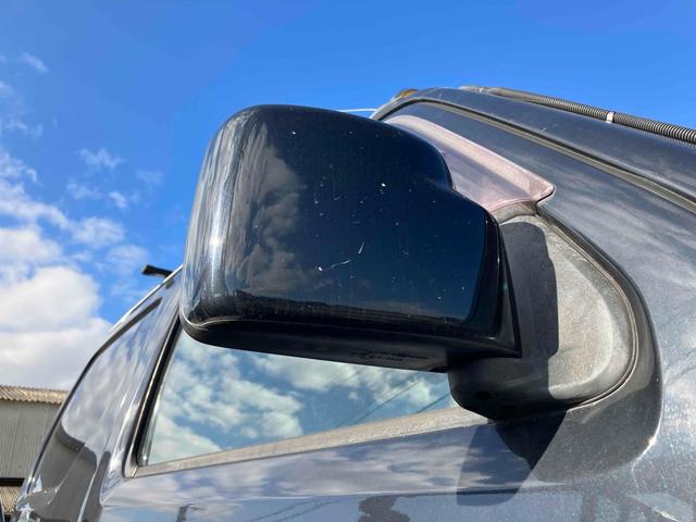 ジムニー ワイルドウインド 4WD ナビ キーレスエントリー 電動格納ミラー シートヒーター MT 盗難防止システム ABS CD DVD再生 ミュージックプレイヤー接続可 Bluetooth ルーフレール アルミホイール(35枚目)