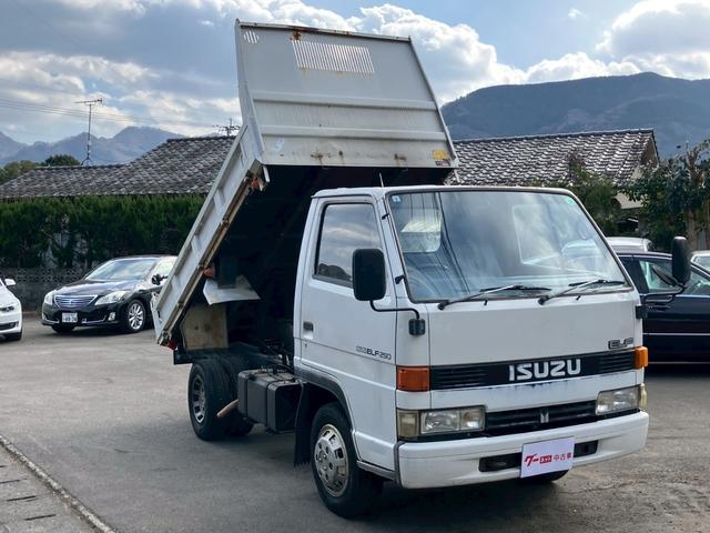 エルフトラック ダンプ　５速マニュアル　ディーゼル　２ｔ積み　リアＷタイヤ　エンジン型式４ＢＥ１　極東開発ＤＤ０２０８　荷台内寸４６９×１６９×１９７　走行９６４００ｋｍ　３人乗り（12枚目）