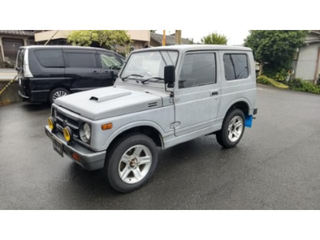 ジムニー 　４ＷＤ　オートマ車　エアコン　パワーステアリング　ＣＤデッキ　社外ハンドル　背面タイヤ　ハードカバー　走行１６５５２８ｋｍ（2枚目）