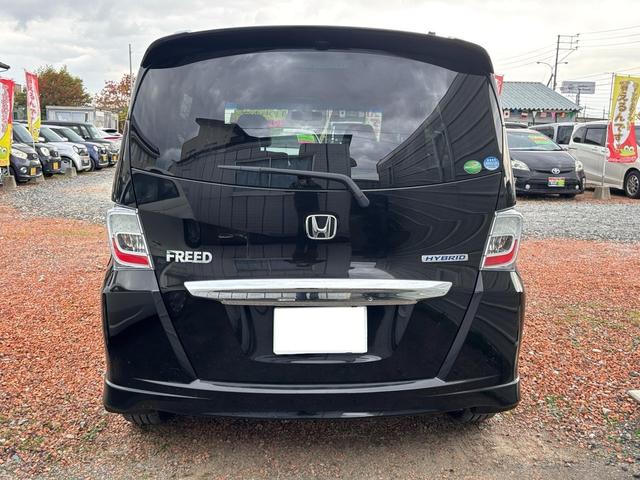 フリードハイブリッド ジャストセレクション セキュリティー 横滑り防止機能 衝突安全ボディ オートクルーズ エアバック キーレスエントリー PS ETC フルオートエアコン ABS パワーウィンドウ 運転席助手席エアバック アイドリングS(5枚目)