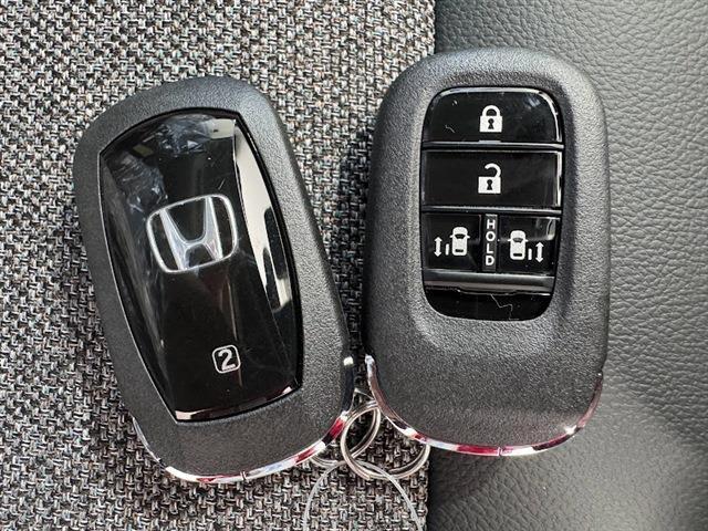 フリード ｅ：ＨＥＶエアー　ＥＸ　届出済未使用車　両側パワースライドドア　ホンダセンシング　純正ディスプレイオーディオ　全方位モニター　フルセグＴＶ　Ｂｌｕｅｔｏｏｔｈ　アダプティブクルーズコントロール（26枚目）