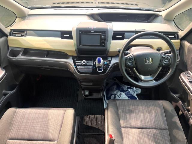 フリードハイブリッド ハイブリッド・Gホンダセンシング 禁煙車 両側電動スライドドア 純正SDナビ バックカメラ 衝突被害軽減システム レーダークルーズコントロール スマートキー LEDヘッド ETC 車線逸脱警報 オートライト オートエアコン(2枚目)