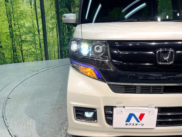 N-BOXカスタム G ターボSSブラックスタイルパッケージ ターボ 両側電動ドア 純正ナビ バックカメラ 衝突軽減 禁煙車 ハーフレザーシート スマートキー HIDヘッド LEDフォグ ETC クルコン オートライト オートエアコン 純正15インチアルミ(12枚目)