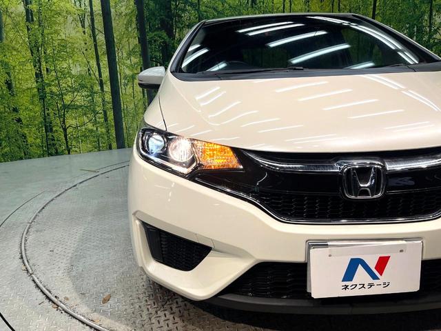 フィット １３Ｇ・Ｌパッケージ　ファインエディション　禁煙車　衝突軽減システム　バックカメラ　ディスプレイオーディオ　ＬＥＤヘッド　ハーフレザー　クルーズコントロール　スマートキー　地デジ　ＣＤ再生　プライバシーガラス　盗難防止装置　アイドリングストップ（12枚目）