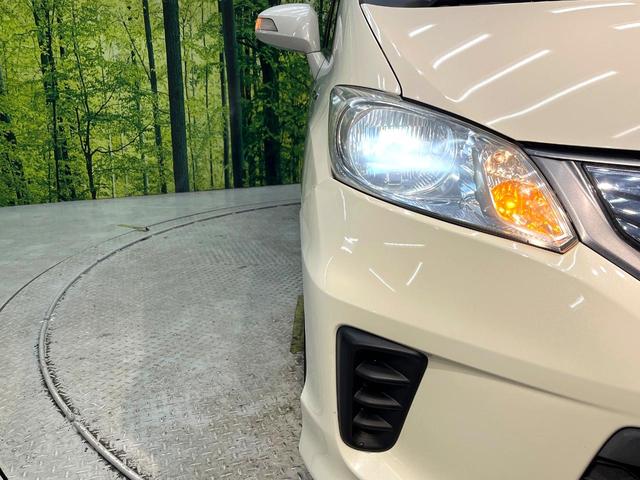 フリードハイブリッド ジャストセレクション　禁煙車　後席モニター　両側電動スライドドア　ナビ　バックカメラ　ＥＴＣ　Ｂｌｕｅｔｏｏｔｈ再生　ハーフレザーシート　ＨＩＤヘッドライト　クルーズコントロール　スマートキー　地デジ　盗難防止装置（12枚目）