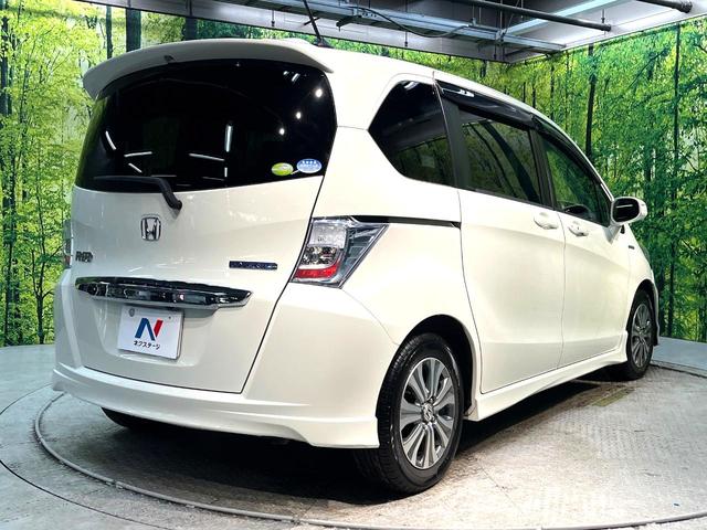 フリードハイブリッド ジャストセレクション　禁煙車　後席モニター　両側電動スライドドア　ナビ　バックカメラ　ＥＴＣ　Ｂｌｕｅｔｏｏｔｈ再生　ハーフレザーシート　ＨＩＤヘッドライト　クルーズコントロール　スマートキー　地デジ　盗難防止装置（17枚目）