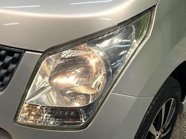 ワゴンＲ ＦＸリミテッド　禁煙車　スマートキー　オーディオ　エアコン　ＣＤ再生　プライバシーガラス　盗難防止システム　ベンチシート　シートアンダートレイ　電動格納ミラー　バニティミラー　１４インチアルミホイール（25枚目）