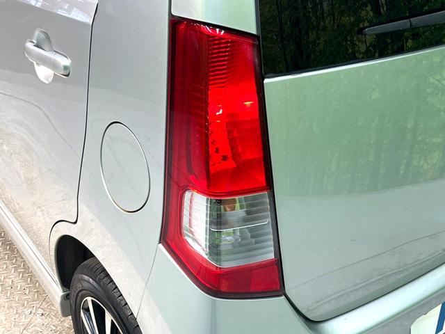 ワゴンＲ ＦＸリミテッド　禁煙車　スマートキー　オーディオ　エアコン　ＣＤ再生　プライバシーガラス　盗難防止システム　ベンチシート　シートアンダートレイ　電動格納ミラー　バニティミラー　１４インチアルミホイール（27枚目）