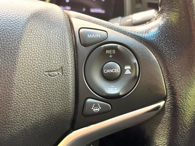 フィットハイブリッド Ｌ　ホンダセンシング　禁煙車　純正ＳＤナビ　バックカメラ　衝突被害軽減システム　ハーフレザーシート　スマートキー　ＬＥＤヘッド　ビルトインＥＴＣ　車線逸脱警報　オートライト　オートエアコン　Ｂｌｕｅｔｏｏｔｈ　ＣＤ（5枚目）