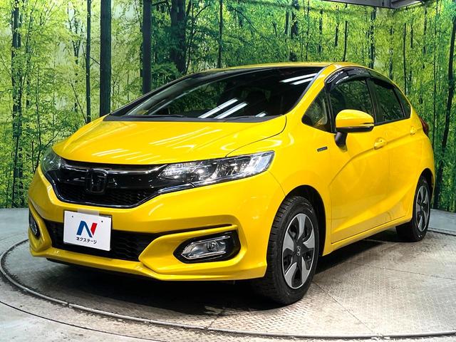 フィットハイブリッド Ｌ　ホンダセンシング　禁煙車　純正ＳＤナビ　バックカメラ　衝突被害軽減システム　ハーフレザーシート　スマートキー　ＬＥＤヘッド　ビルトインＥＴＣ　車線逸脱警報　オートライト　オートエアコン　Ｂｌｕｅｔｏｏｔｈ　ＣＤ（21枚目）